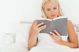 Cute woman reading a book