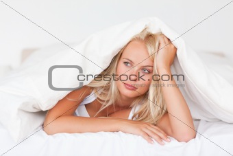 Woman under a duvet