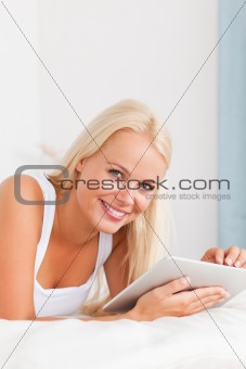 Portrait of a smiling woman with a tablet computer