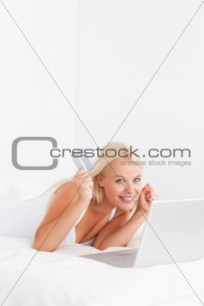 Portrait of a cheerful woman buying online