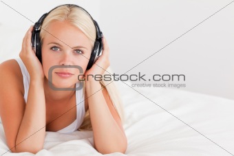 Blonde woman listening to music