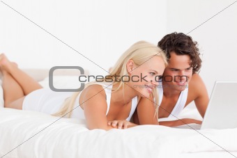 Couple using a notebook