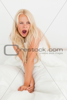Portrait of a cute woman yawning