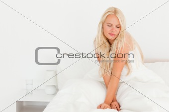 Blonde woman waking up