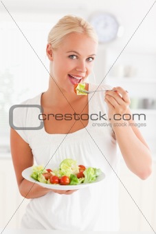 Woman eating a salad