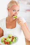 Portrait of a woman eating a salad
