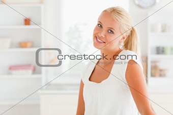 Woman posing in her kitchen