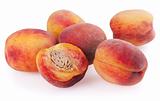 Many ripe peaches isolated on a white background