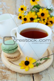 french dessert   macaroons and a cup of tea