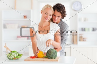 Couple slicing pepper