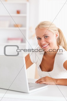 Portrait of a cute woman with a laptop