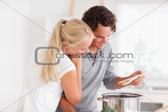Couple tasting a meal