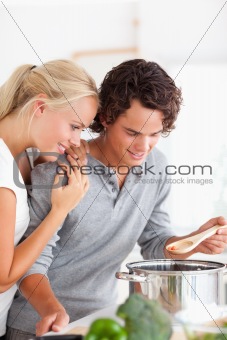 Portrait of a couple tasting a meal