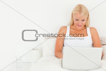 Beautiful blonde woman using a laptop