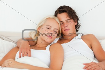 Couple sleeping in their bedroom