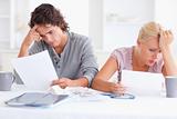 Stressed Couple with Paperwork