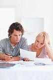 Worried Couple with Paperwork