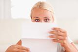 Shocked woman reading a letter