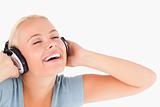 Close up of a laughing woman with headphones