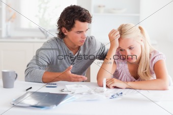 Arguing couple at a table