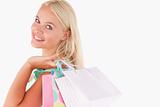 Portrait of a Joyful blond woman with shopping bags