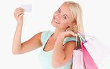 Woman with shopping bags and a credit card