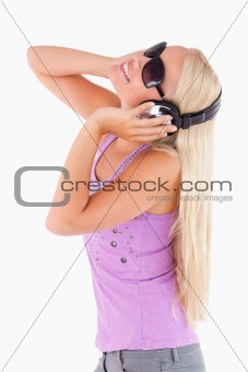 Woman with earphones and sunglasses