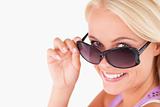 Cute lady peeking over her sunglasses
