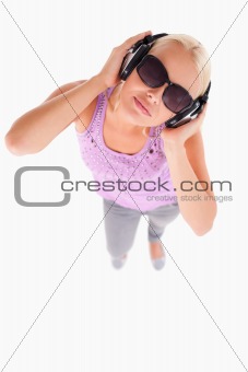 Gorgeous lady with sunglasses and earphones