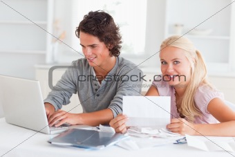 Happy couple doing their accounts