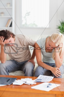 Unhappy couple on a sofa