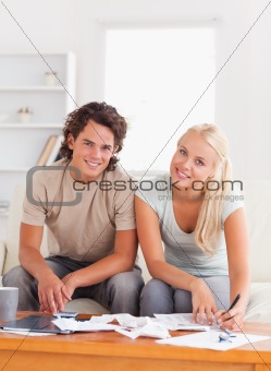 Happy couple calculating