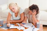 Unhappy couple listing expenses