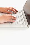 Hands on keyboard of laptop