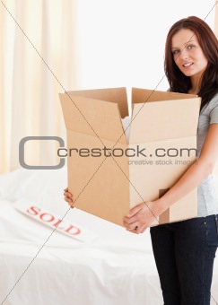Female with cardboard