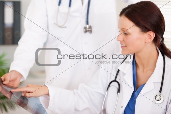 Female doctor pointing on x-ray