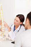 Doctor pointing on spine