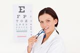 Kind female optician with an eye test