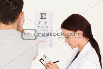 Female optician and patient 
