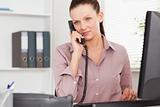 Telephoning businesswoman in her office