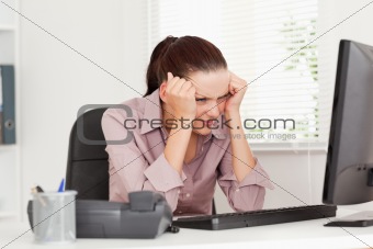 Frustrated businesswoman is office