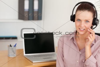 Operator with headset by laptop