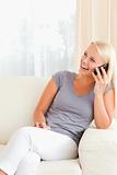 Portrait of a laughing woman on the phone