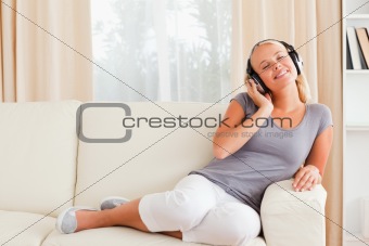 Pleased woman listening to music