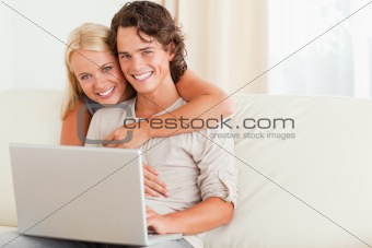 Happy couple with a notebook