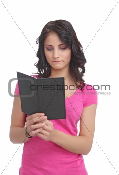 Sad young teen with a book