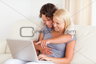 Young couple using a notebook