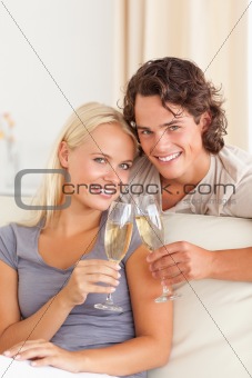 Portrait of a young couple making a toast