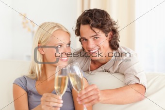Beautiful couple making a toast