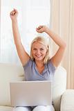 Portrait of a cheerful woman using a laptop